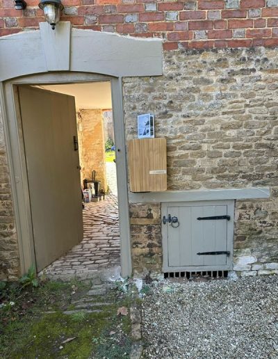 Andersen A2 ev car charger home installation with a wood effect cover