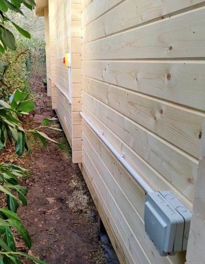 Isolator switch in garden outbuilding